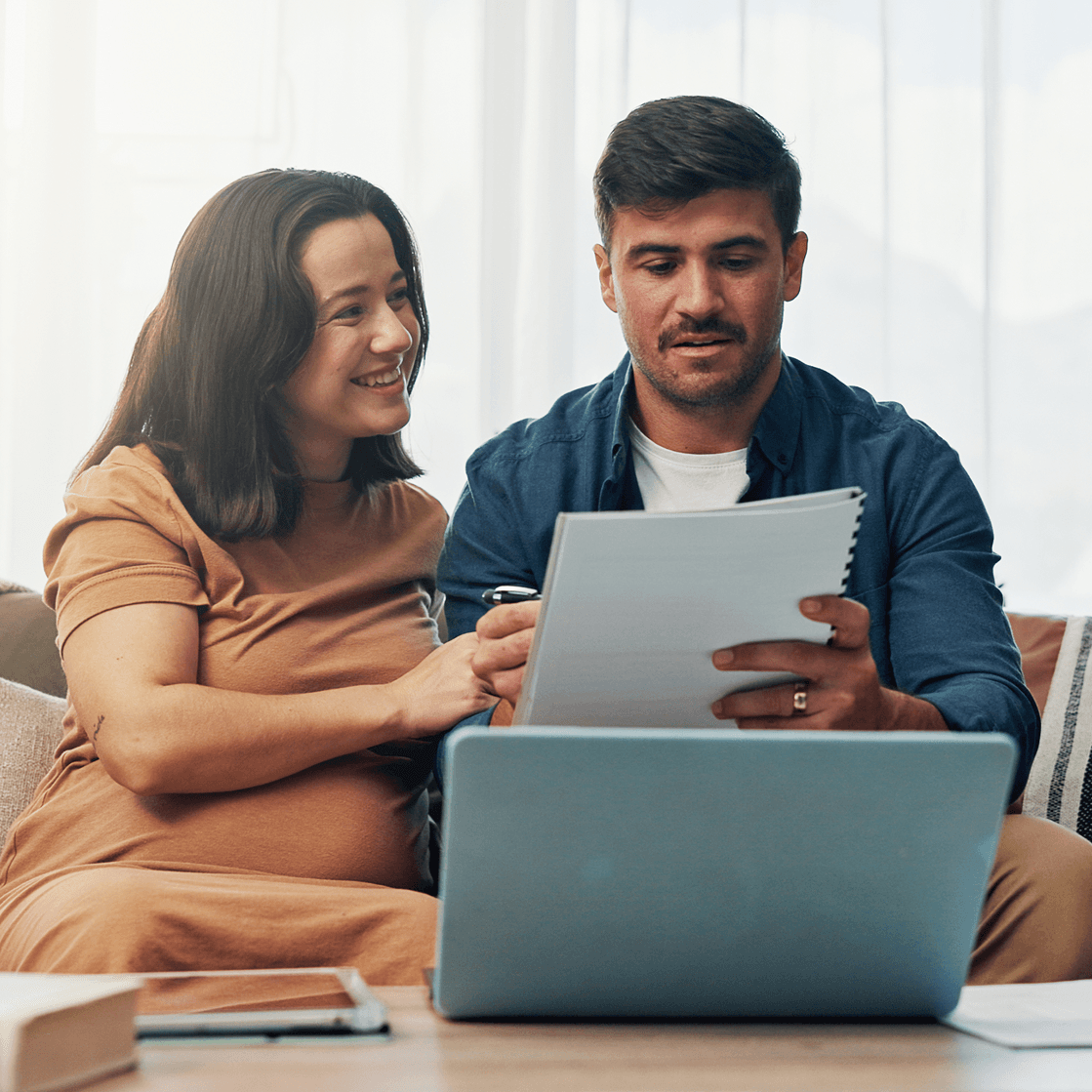 A couple reviewing their agreement together on a laptop