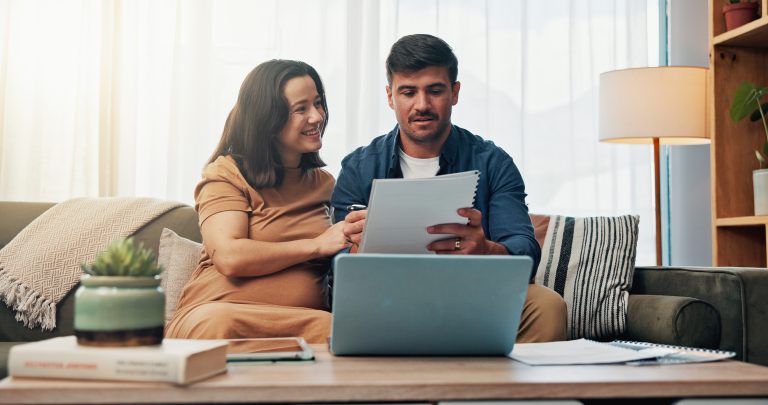 Couple, pregnancy and paperwork for finance in home, sofa and happy with results, investment or savings